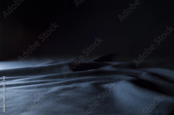 Fototapeta Dark blue velour with a side light and dark shadows - ideal for product displays and and backgrounds