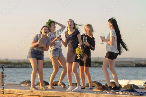 Fototapeta Summer party of young beautiful womans with wine, sea resort relaxing in sunny day  