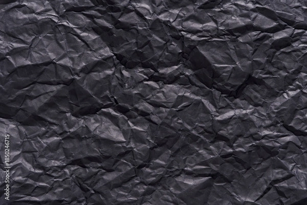 Obraz Crumpled black paper texture background for creative design and art projects.