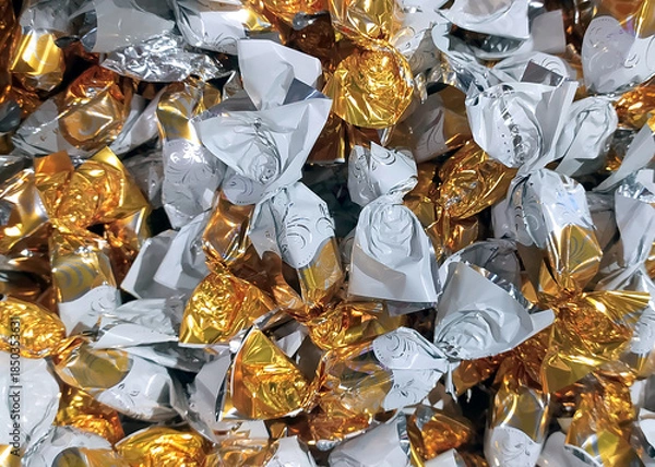 Obraz Hungarian christmas sweetness handmade parlour candy. Original christmas sweetness from Hungary name is szaloncukor aka parlour candy. Sweetness fondant in colorful metal wrapping