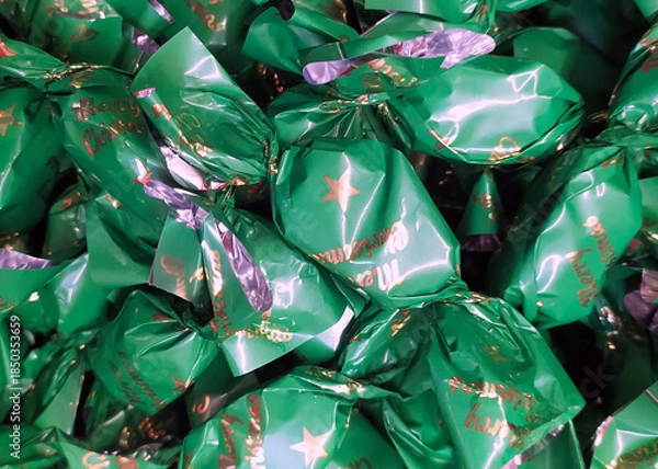 Obraz Hungarian christmas sweetness handmade parlour candy. Original christmas sweetness from Hungary name is szaloncukor aka parlour candy. Sweetness fondant in colorful metal wrapping