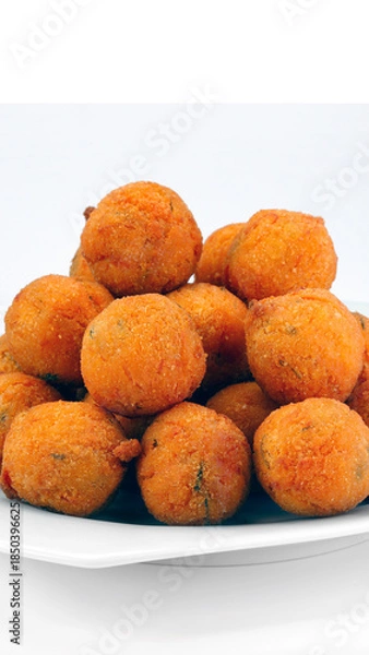 Obraz cod dumpling, salt cod fritters, bunuelos de bacalao. Brazilian snack "bolinho de bacalhau"