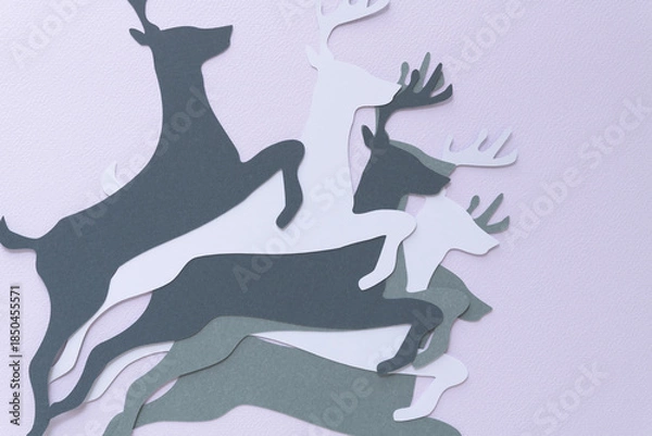 Obraz leaping reindeer paper shapes on blank paper