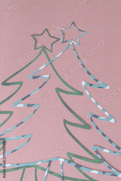 Obraz two holiday tree outlines with stars on blank paper