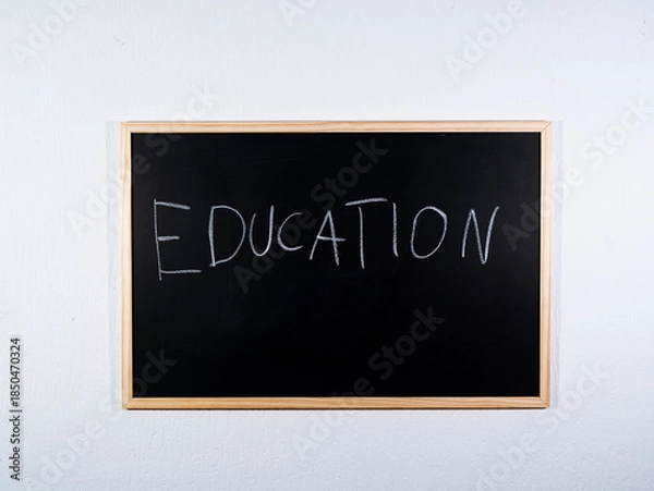 Obraz Chalkboard showing EDUCATION concept on black background representing schooling, knowledge and learning process