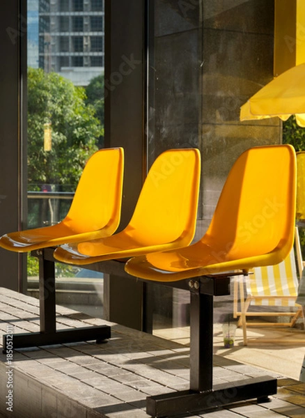 Obraz yellow plastic seats in a playground