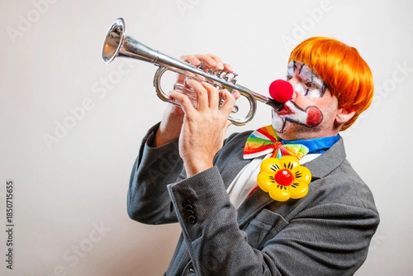 Obraz Clown playing trumpet performing comedy act