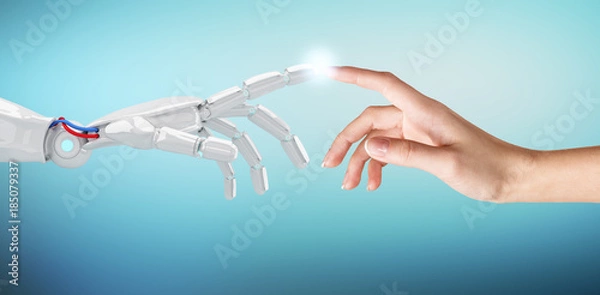 Obraz Human hand touching an android hand.