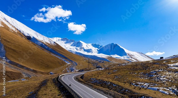Obraz Aerial view of Winding Mountain Road with Snow-Capped Peaks in Road Through the Great Caucasus ,Georgia
