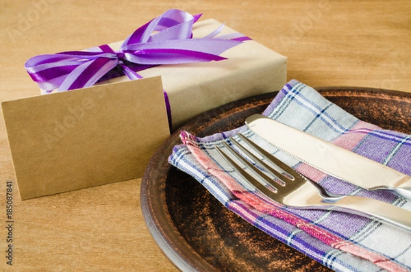 Obraz Festive Table Setting with Postcard and Present.