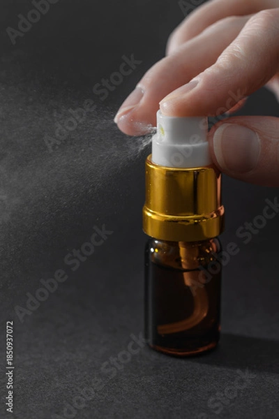 Obraz Perfume atomizer close-up, spray with atomizer