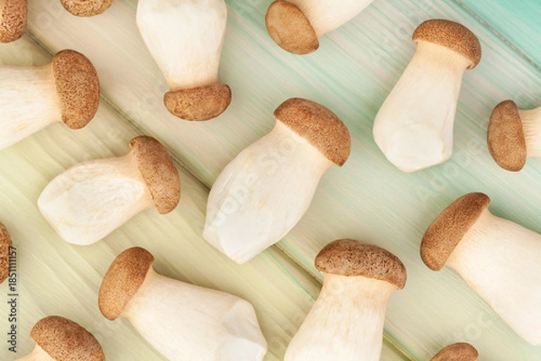 Fototapeta king oyster on wood background top view