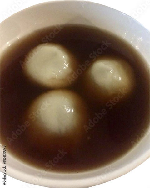Obraz Isolated Black Sesame Dumplings in Ginger Syrup