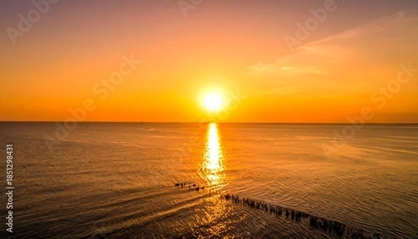 Obraz Sunset over a calm ocean (1)