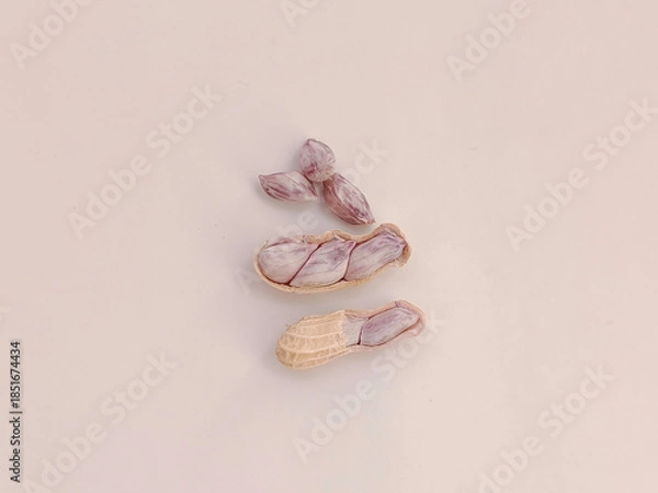 Fototapeta Top view of Boiled peanuts, both shelled and unshelled, on a white background.