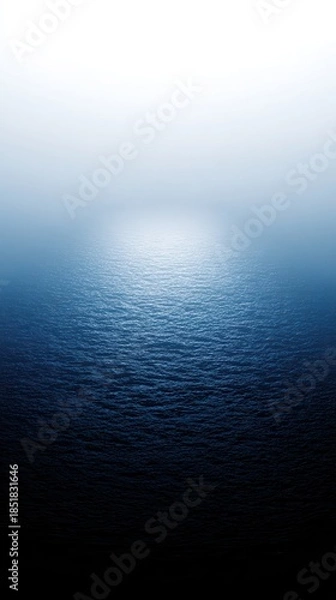 Obraz Ocean surface with reflecting light creates a serene blue gradient
