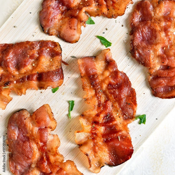 Obraz  Crispy bacon on wooden cutting board