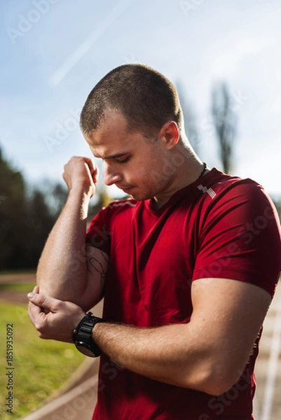Obraz Athlete man Having Arm Injury