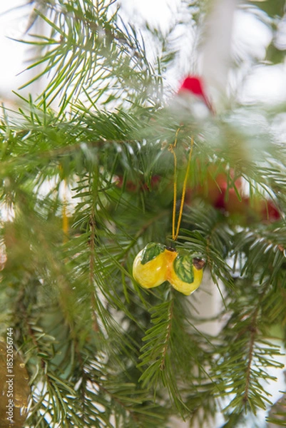 Obraz Spruce branches decorated with New Year and Christmas decorations