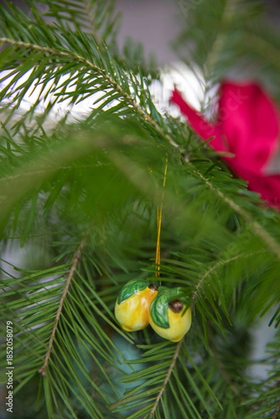 Obraz Spruce branches decorated with New Year and Christmas decorations
