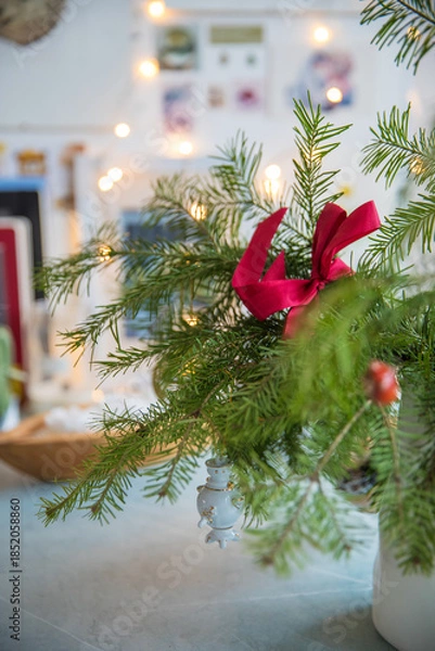 Obraz Spruce branches decorated with New Year and Christmas decorations