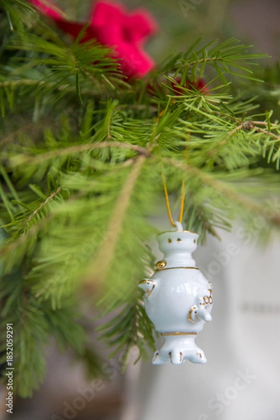 Obraz Spruce branches decorated with New Year and Christmas decorations