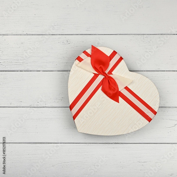 Obraz Heart shaped gift box over white