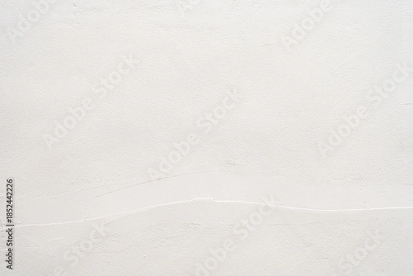 Obraz White plaster wall texture background with subtle cement brush strokes for copy space.