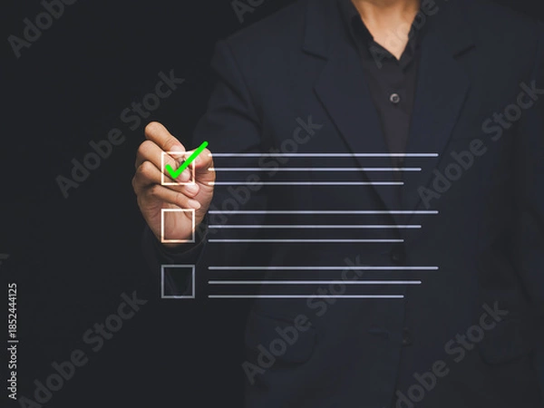 Obraz Businessman checking checklist for approval and quality control.