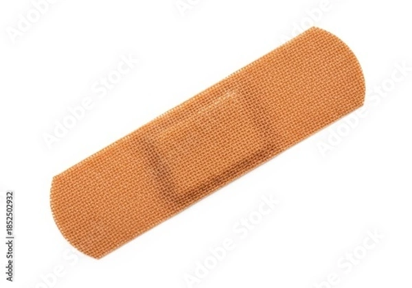 Fototapeta A single adhesive bandage isolated on white background