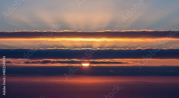 Obraz Dramatic Sunset Over Ocean With Sun Rays Breaking Through Clouds.
