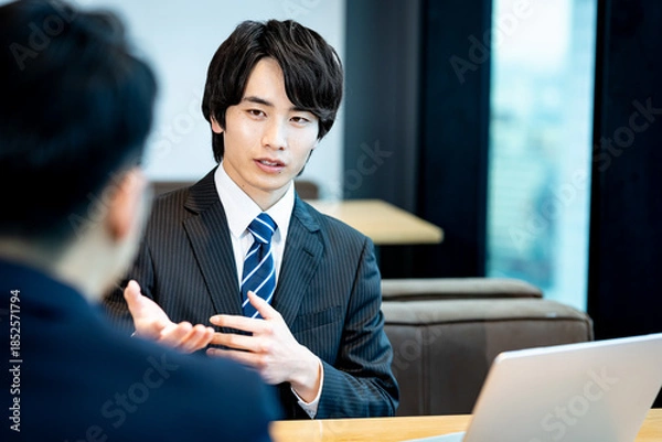 Obraz 打ち合わせするビジネスパーソン