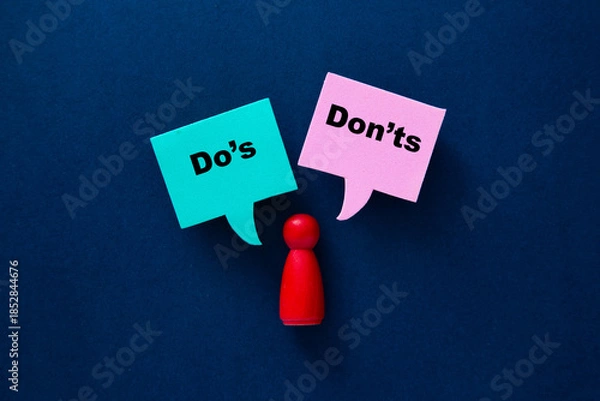 Obraz Person choosing between do's and don'ts guidelines
