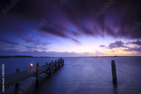 Fototapeta A tranquil sunset over a lake in the Netherlands