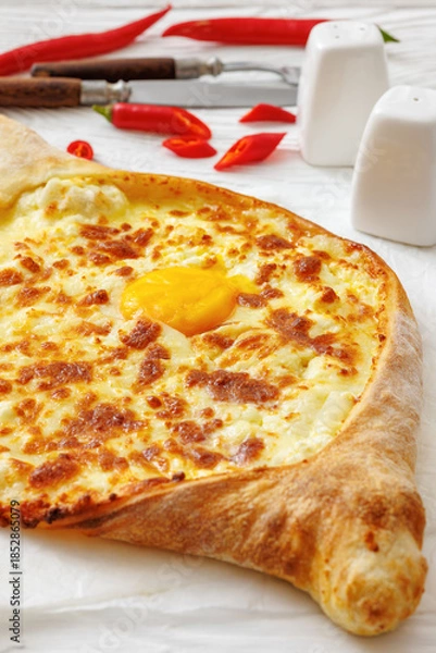 Fototapeta Adjarian Khachapuri with egg yolk and cheese