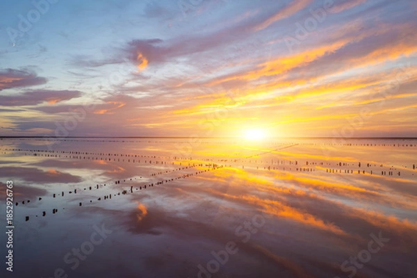 Obraz Vibrant sunset reflection over calm salt lake