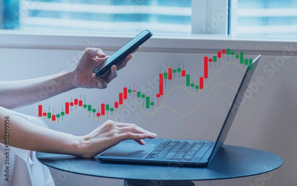 Fototapeta オフィスで市場チャートを確認するビジネスイメージ