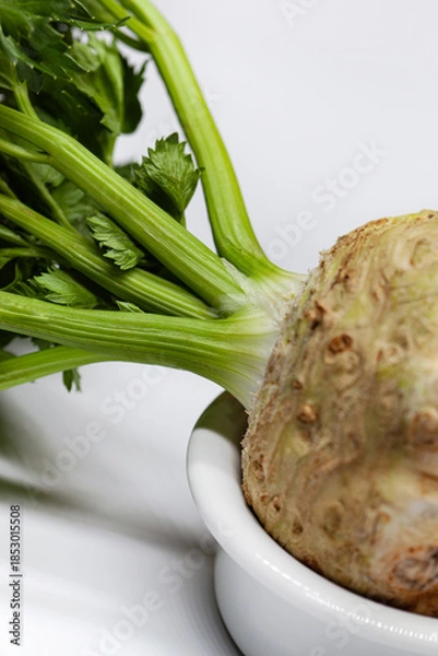 Obraz Raw vegetable in a bowl on a white background