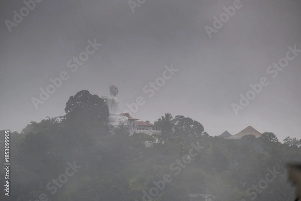 Obraz A view of the city of Kandy from the opposite shore of Lake Kandy, Sri Lanka. A historic Buddhist temple with a relic is located in this city. The rain begins during Hurricane Dilwa.