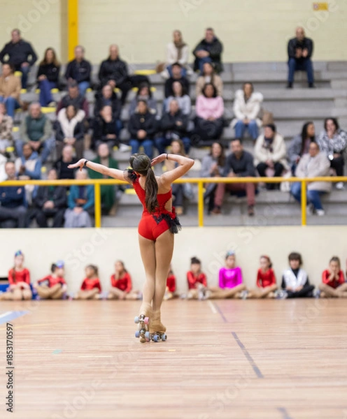 Obraz Young skater performing artistic roller skating routine
