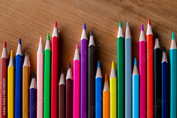 Obraz Colored pencils arranged like a bar graph (horizontal view).