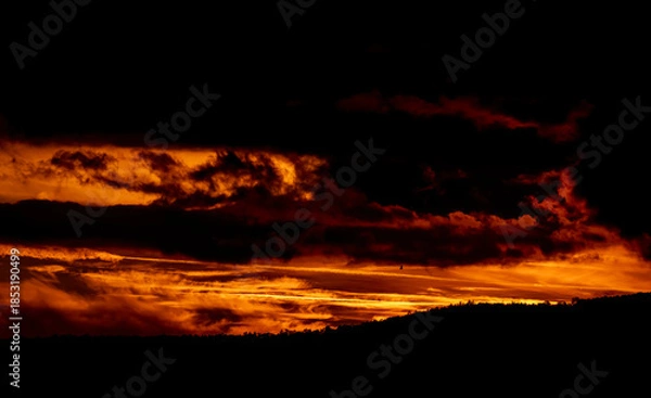 Fototapeta Dramatic sunset background with cloudy sky.