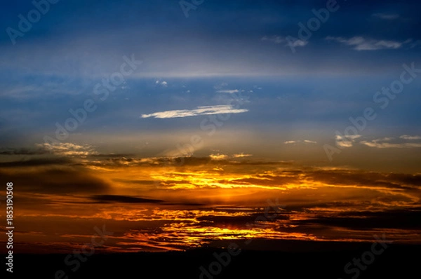 Fototapeta Dramatic sunset background with cloudy sky.