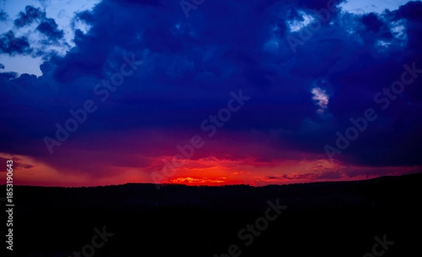 Fototapeta Dramatic sunset background with cloudy sky.