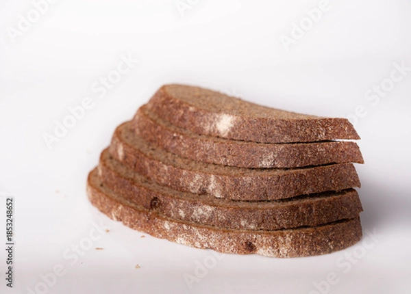 Obraz A stack of rye bread on a white background, space for text