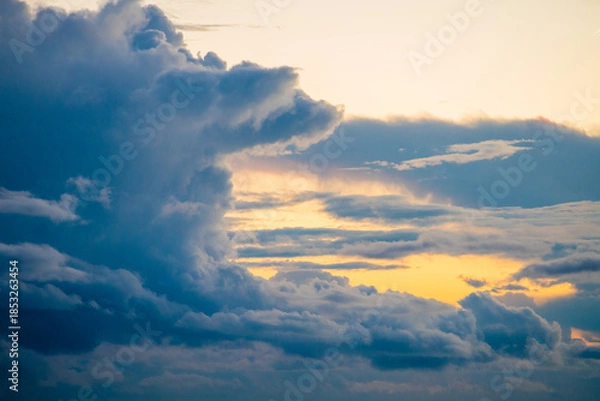 Obraz Dramatic Sunset Sky with Golden Light and Dark Storm Clouds