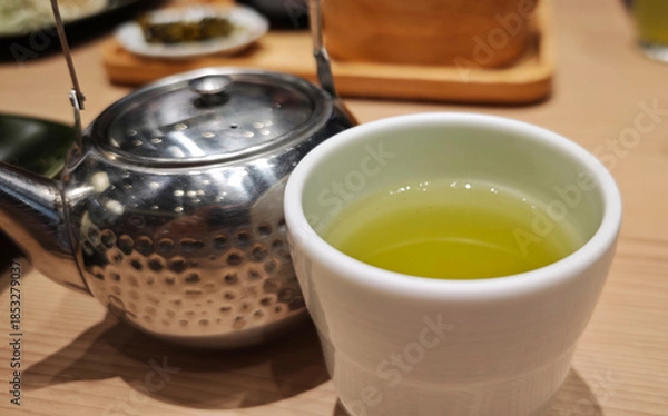 Obraz Hot matcha tea in a cup.