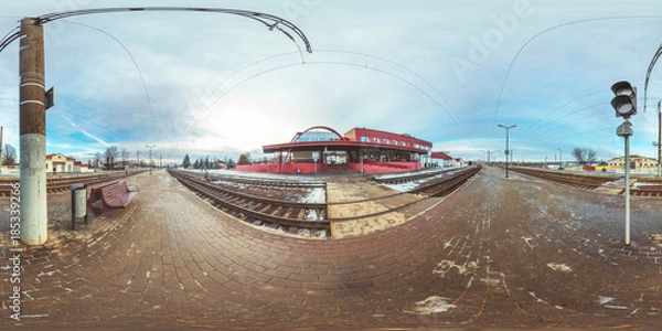 Fototapeta 3D spherical panorama with 360 viewing angle.  Ready for virtual reality or VR. Full equirectangular projection. Winter landscape with snow. Cold blue sunset at platform at the railway station.