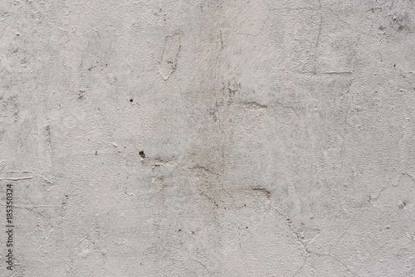 Fototapeta Wall fragment with scratches and cracks