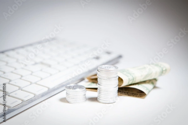 Obraz laptop and coins on white background